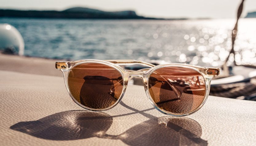 white framed brown lens sunglasses